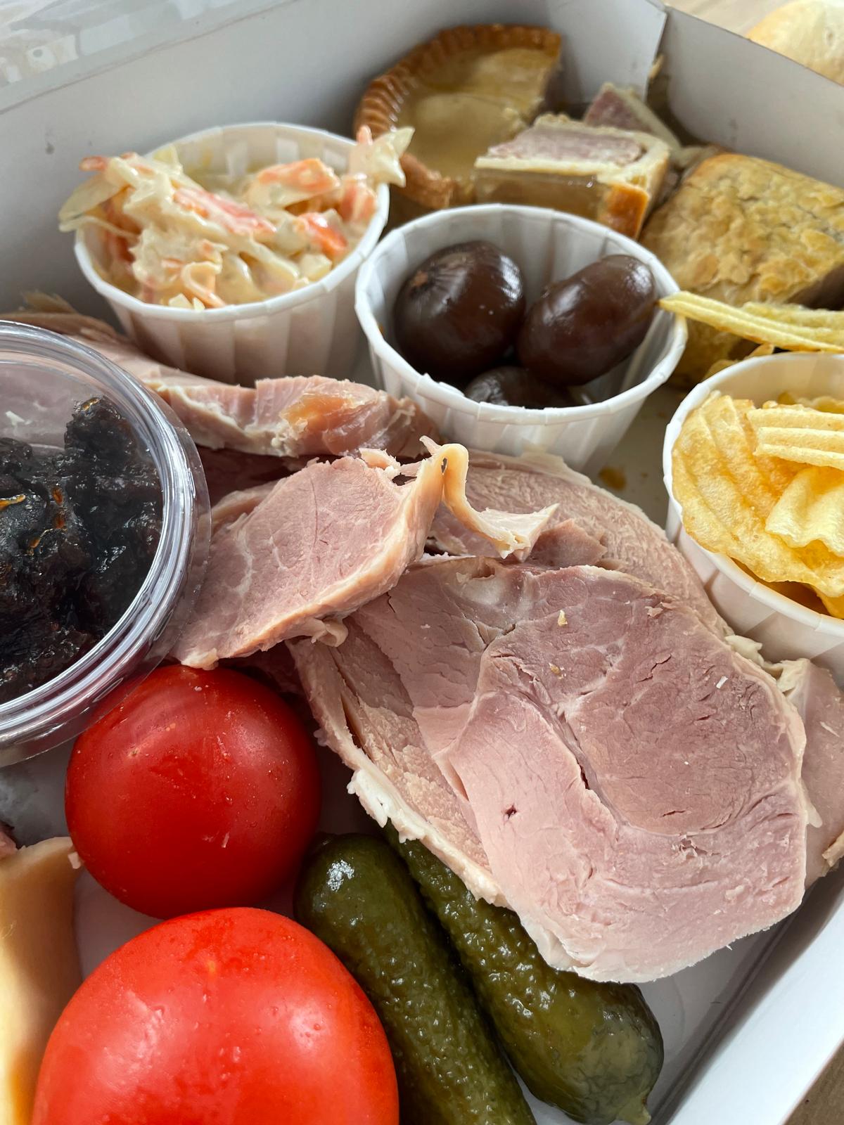 Ploughman’s platter for 2 £30 includes a selection of local cheeses slow cooked ham balsamic onions pork pie sausage roll coleslaw crisps tomatoes and celery ❤
